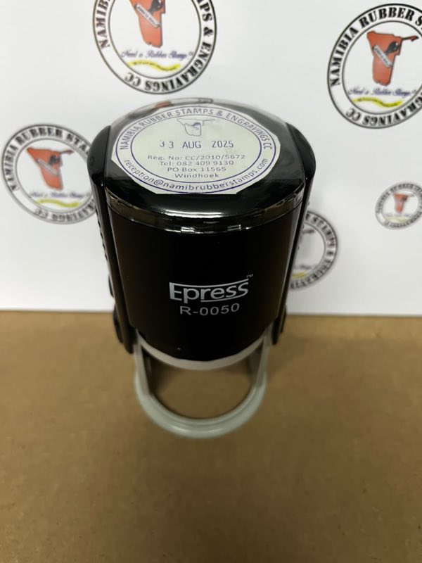 Top view of the Epress R-0050 round dater showing the printed die