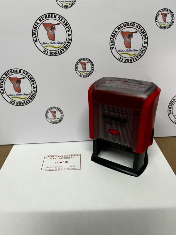 A self-inking stamp beside the impression it makes