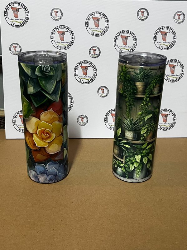 A tall insulated skinny tumbler printed with a full-colour design
